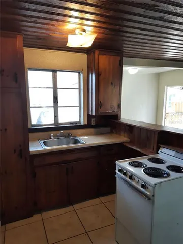 a kitchen with a stove and a sink