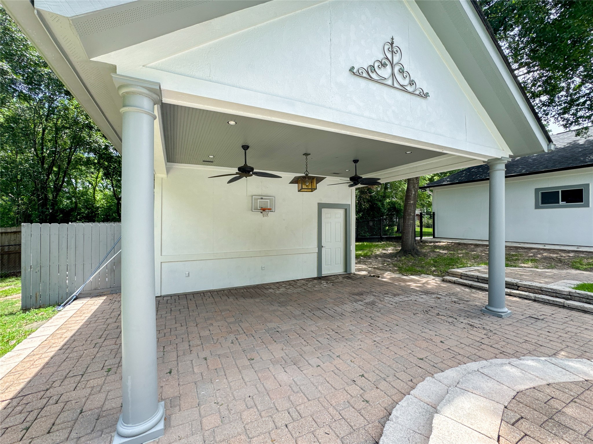 1810 Woerner Road Houston, TX 77090 - Photo 38 of 39 Charming covered patio with a versatile pool house for storage or entertainment.