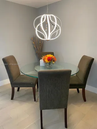 a kitchen with white cabinets and a stove