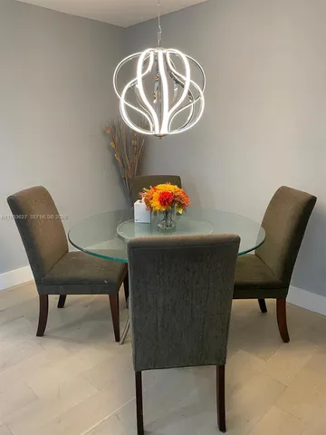 a kitchen with white cabinets and a stove