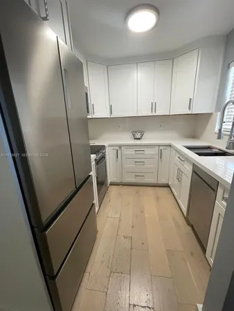 a kitchen with a stove and a microwave