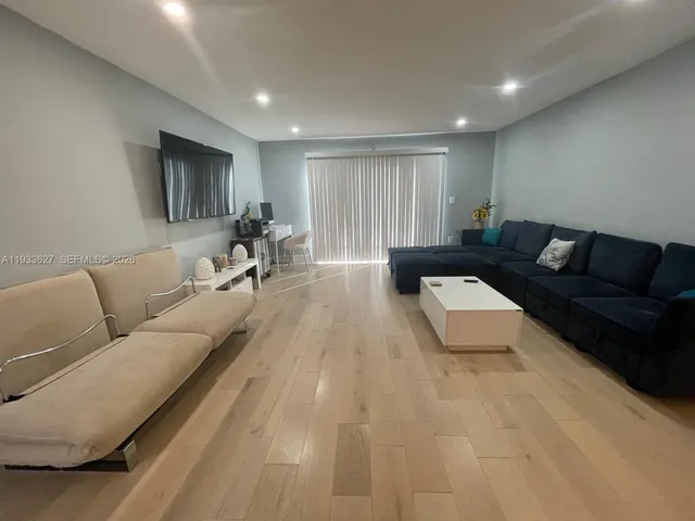 a living room with furniture and a couch