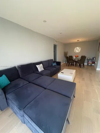 a workspace with furniture and a wall painting