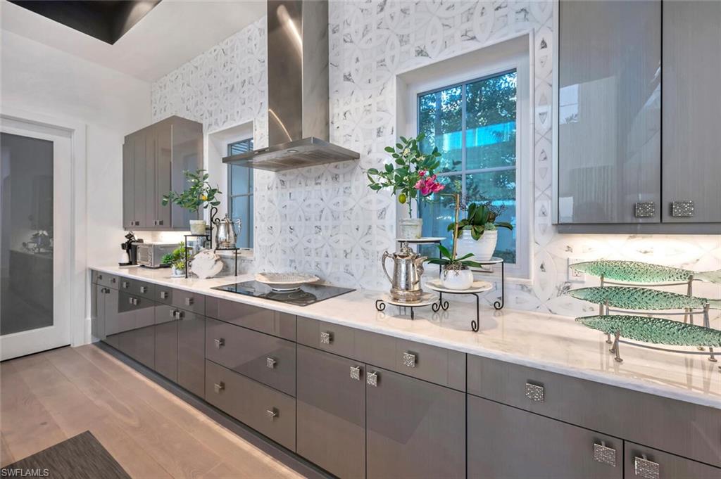 9193 Mercato Way Naples, FL 34108 - Photo 12 of 36 a bathroom with a sink and a mirror