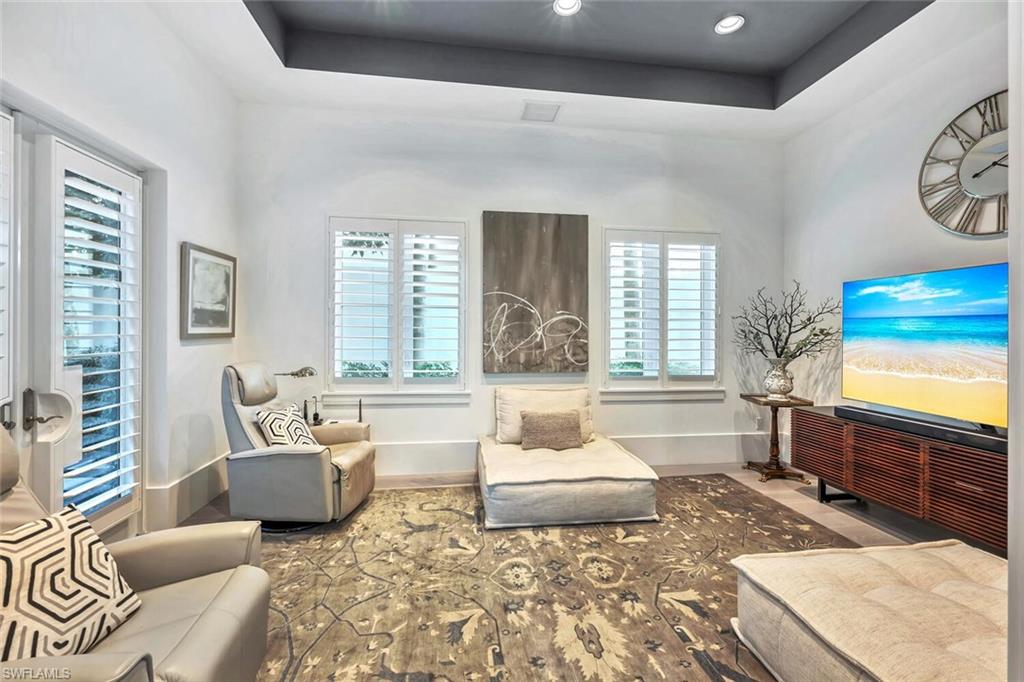 9193 Mercato Way Naples, FL 34108 - Photo 19 of 36 a living room with furniture and a window