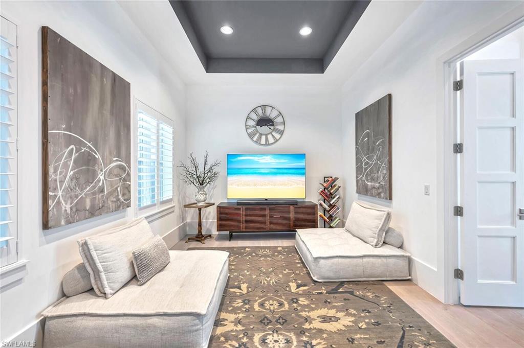 9193 Mercato Way Naples, FL 34108 - Photo 20 of 36 a living room with furniture and a rug