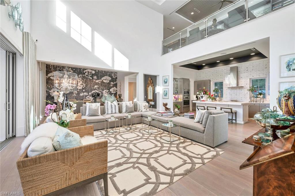 9193 Mercato Way Naples, FL 34108 - Photo 3 of 36 a living room with furniture dining area and a large window