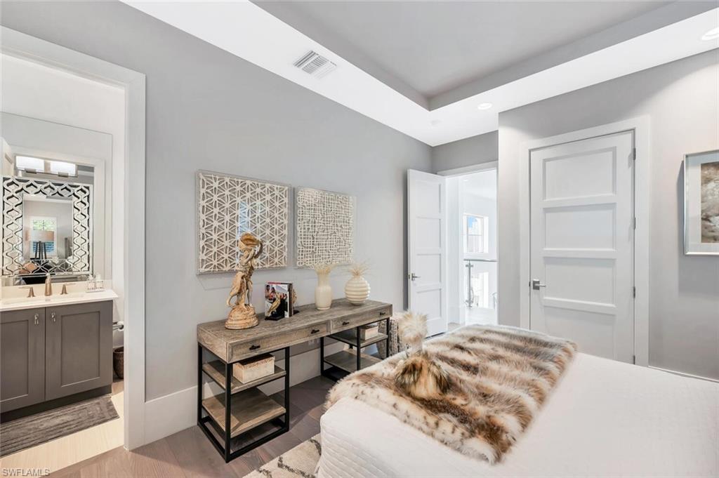 9193 Mercato Way Naples, FL 34108 - Photo 32 of 36 a bedroom with a bed and a window