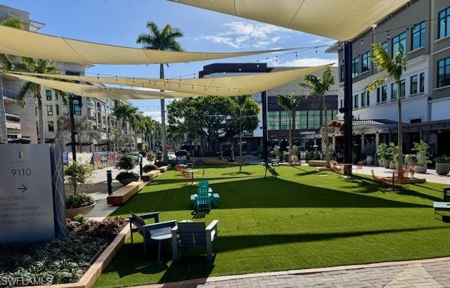 9193 Mercato Way Naples, FL 34108 - Photo 35 of 36 a view of a swimming pool with a patio