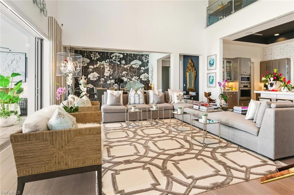 9193 Mercato Way Naples, FL 34108 - Photo 5 of 36 a living room with furniture and a large window