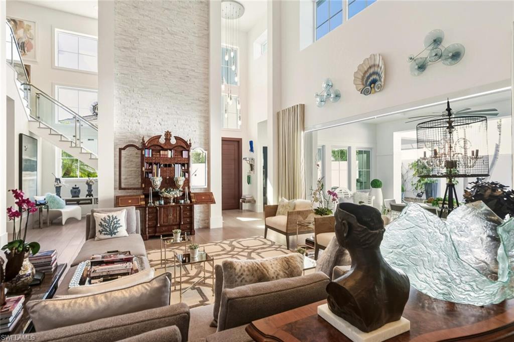 9193 Mercato Way Naples, FL 34108 - Photo 6 of 36 a living room with furniture and a large window