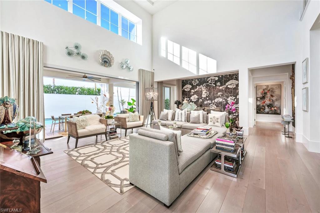 9193 Mercato Way Naples, FL 34108 - Photo 7 of 36 a living room with furniture and a large window
