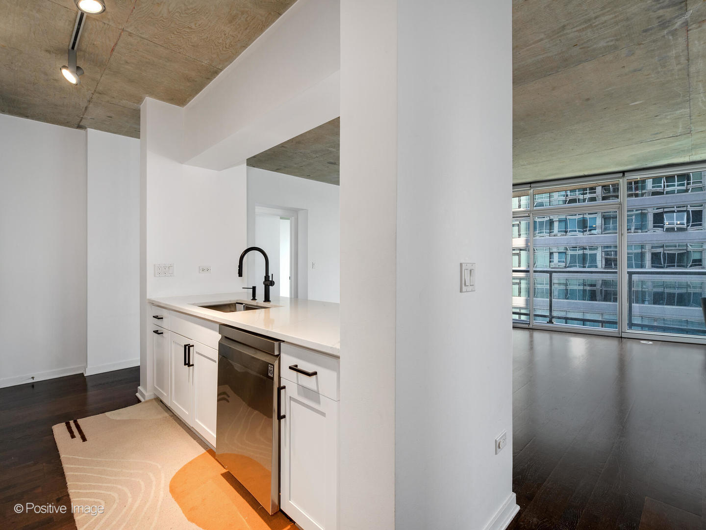 611 South Wells Street, Unit 906 Chicago, IL 60607 - Photo 15 of 21 a spacious bathroom with a sink and a mirror