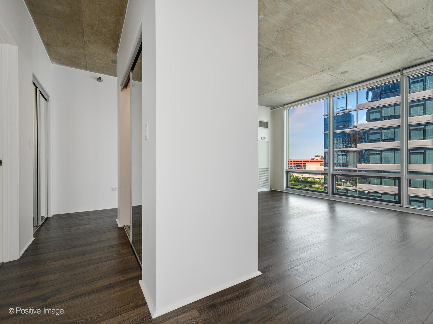 611 South Wells Street, Unit 906 Chicago, IL 60607 - Photo 17 of 21 a view of a hardwood floor and staircase in a room