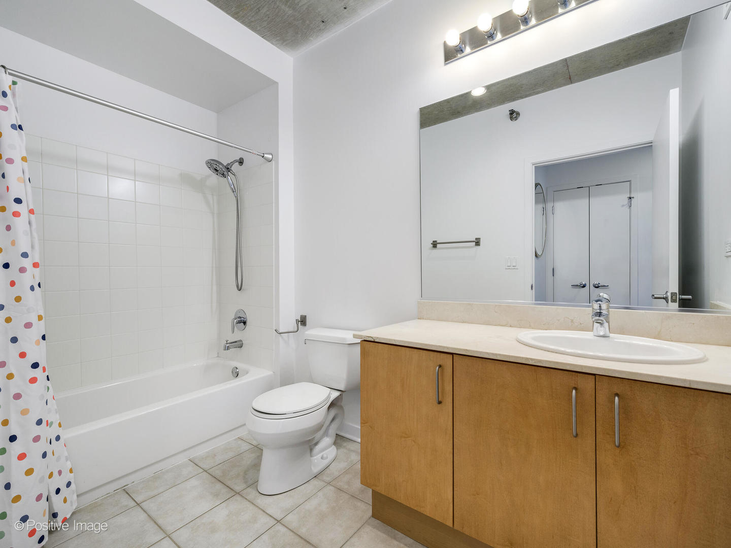 611 South Wells Street, Unit 906 Chicago, IL 60607 - Photo 20 of 21 a bathroom with a granite countertop sink toilet and shower