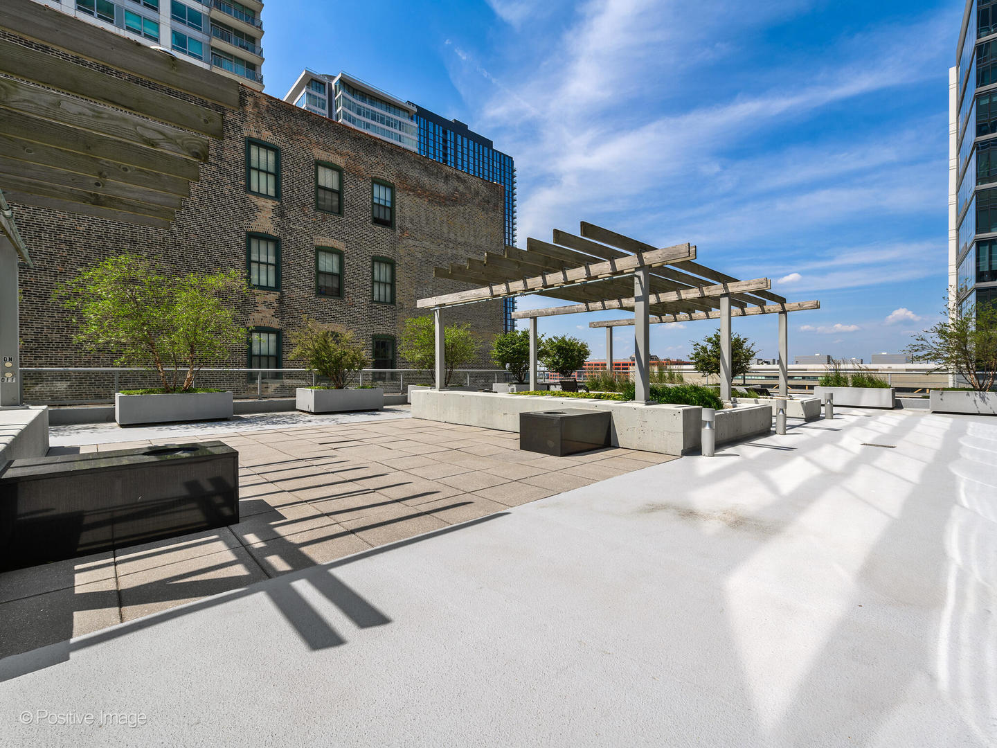 611 South Wells Street, Unit 906 Chicago, IL 60607 - Photo 6 of 21 a outdoor view of a building with sitting area