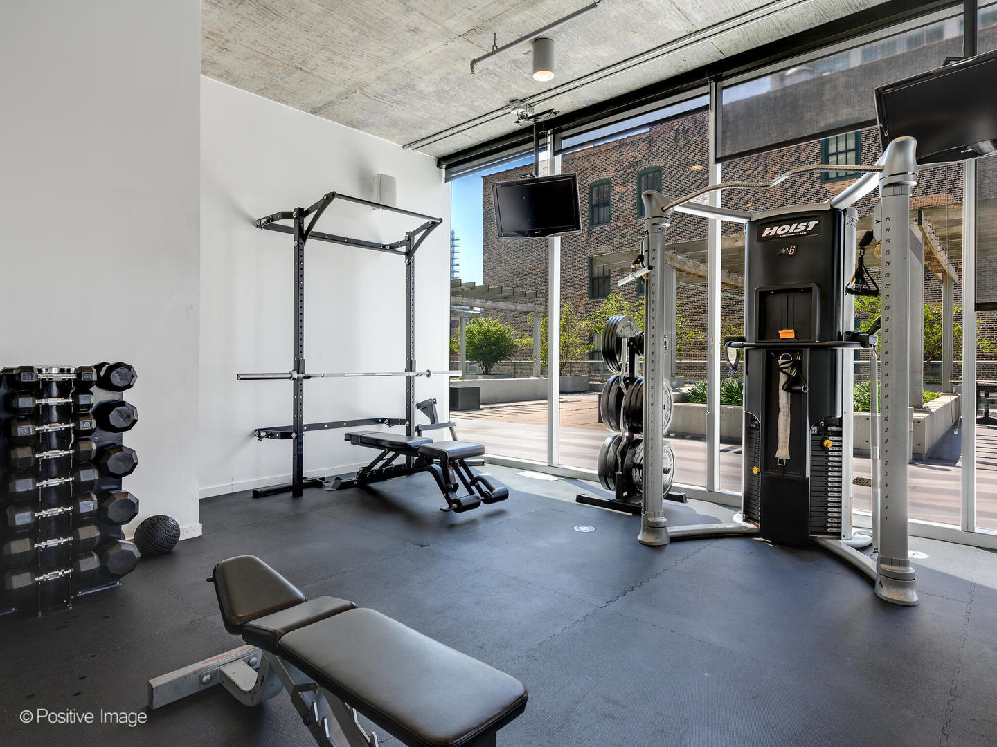 611 South Wells Street, Unit 906 Chicago, IL 60607 - Photo 7 of 21 a view of a room with gym equipment