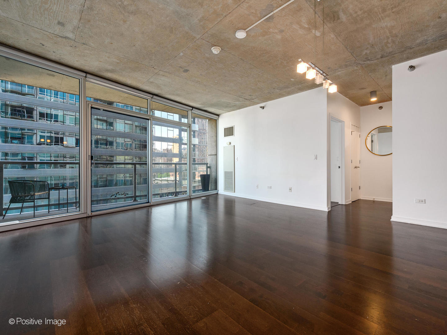 611 South Wells Street, Unit 906 Chicago, IL 60607 - Photo 8 of 21 a view of empty room with wooden floor and fan