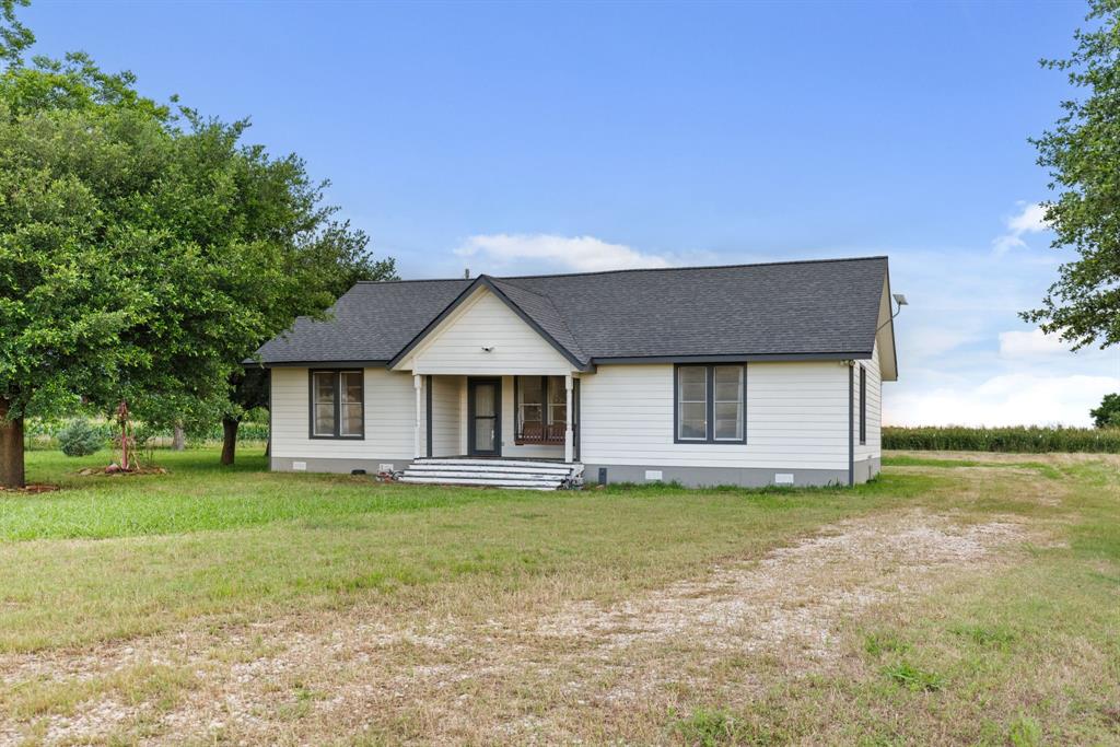 300 Grellhesl Road West, TX 76691 - Photo 1 of 35 a front view of a house with a yard
