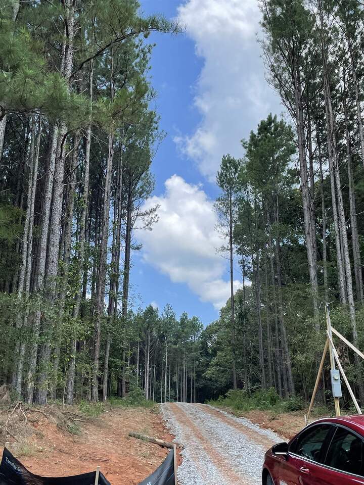 1339 West L Williams Road Commerce, GA 30530 - Photo 1 of 1 a view of a backyard with plants and trees