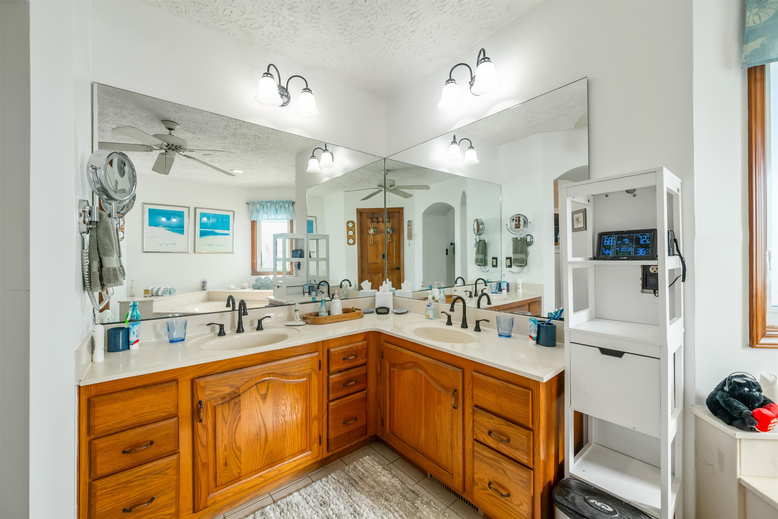 4746 National Drive Myrtle Beach, SC 29579 - Photo 18 of 40 Full bathroom featuring double vanity, a textured ceiling, light tile patterned floors, and a ceiling fan
