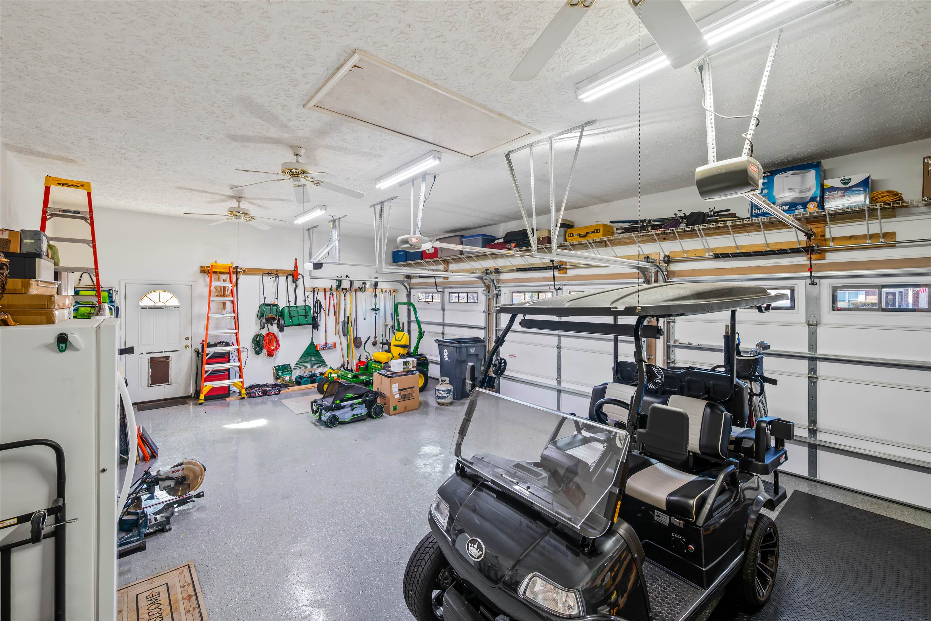 4746 National Drive Myrtle Beach, SC 29579 - Photo 30 of 40 Garage featuring a ceiling fan and a garage door opener