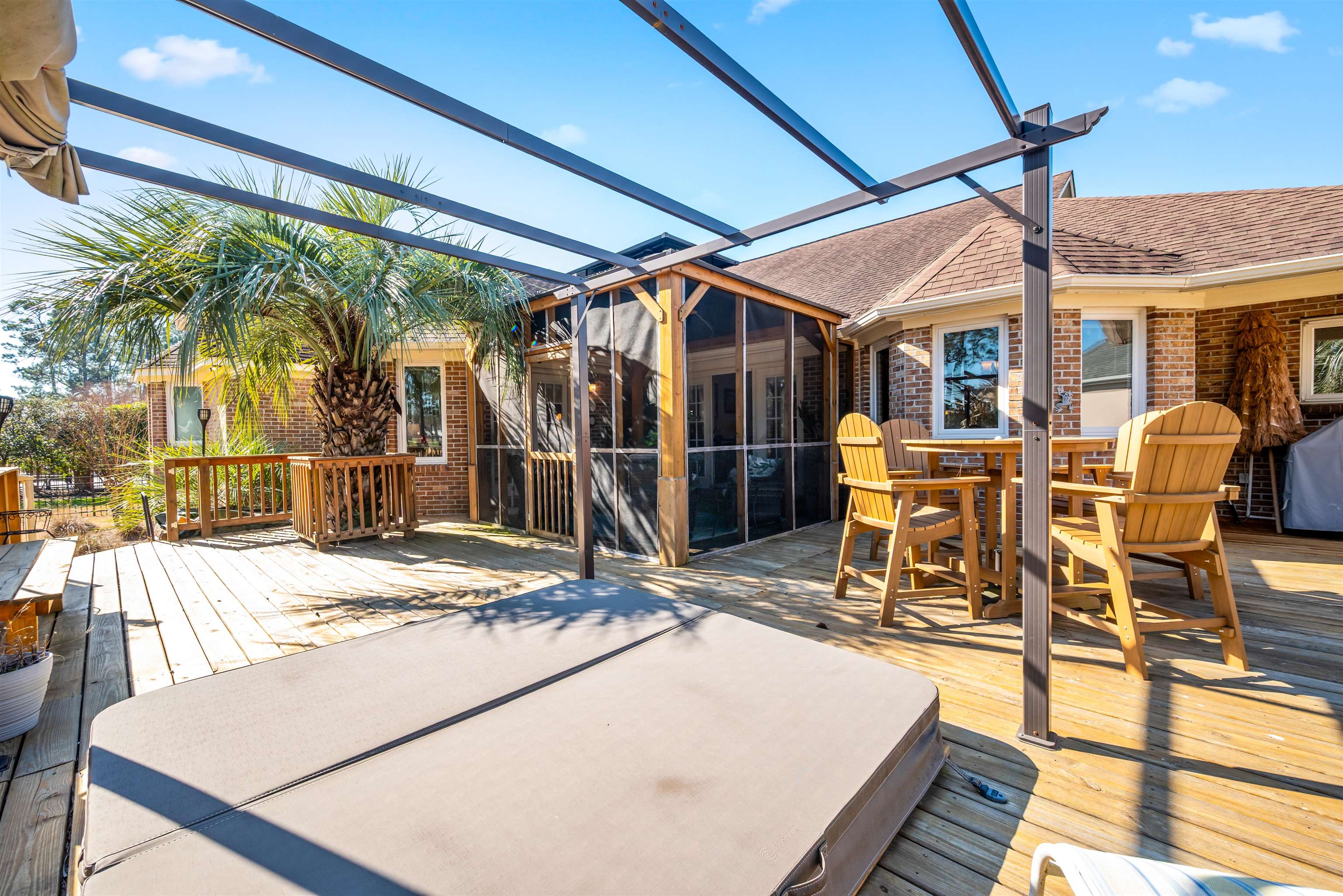 4746 National Drive Myrtle Beach, SC 29579 - Photo 37 of 40 Wooden terrace featuring a sunroom and outdoor dining area