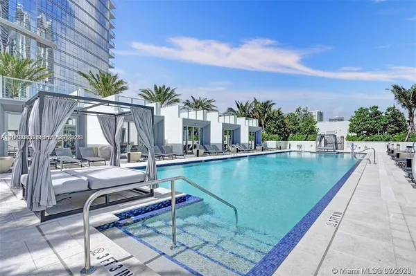 a view of swimming pool with chairs
