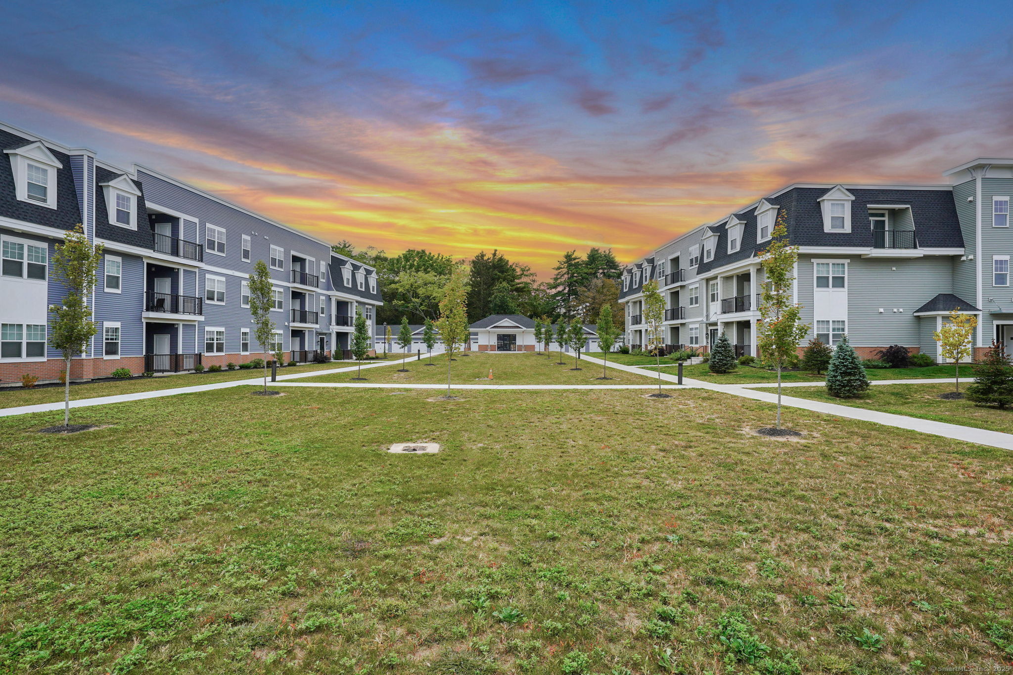 280 Salmon Brook Street, Unit 6202A Granby, CT 06035 - Photo 27 of 34 a view of a building with a big yard