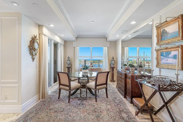 a view of a swimming pool with furniture