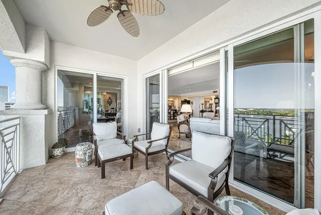 a kitchen with granite countertop a white cabinets and window