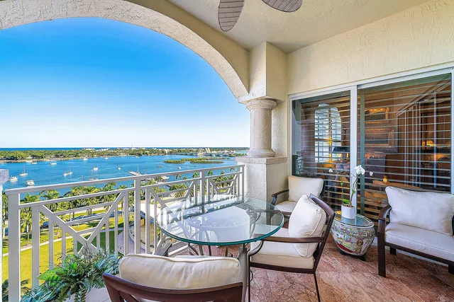 a living room with furniture a rug and a window