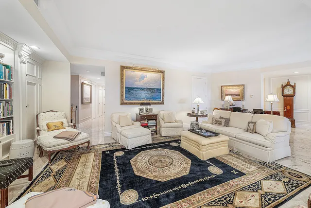 a bedroom with furniture and a large window