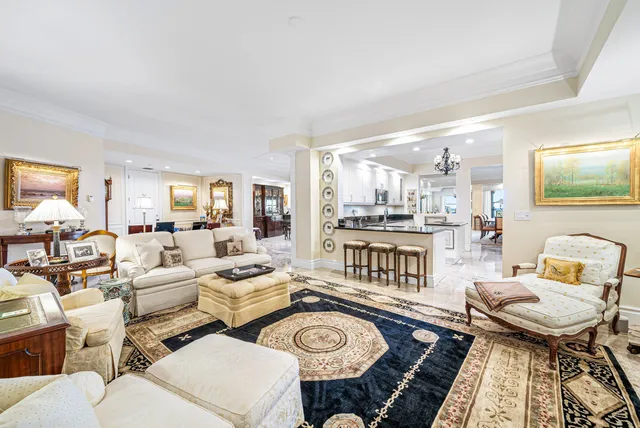 a large bathroom with a granite countertop tub sink shower and mirror