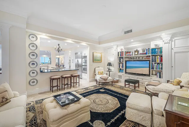 a bathroom with a tub a sink and a window