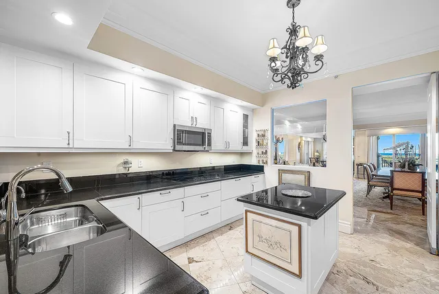 a bathroom with a tub sink shower and mirror
