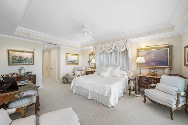 a bedroom with a bed and a couch