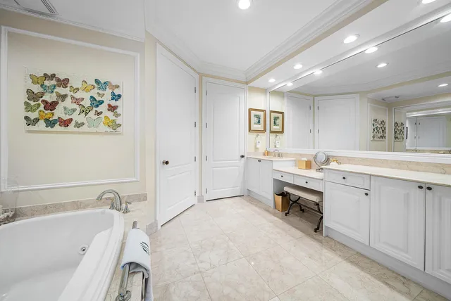 a living room with furniture a large window and a flat screen tv