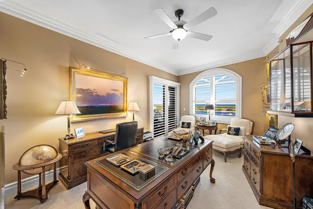 a bathroom with a granite countertop sink mirror and a toilet