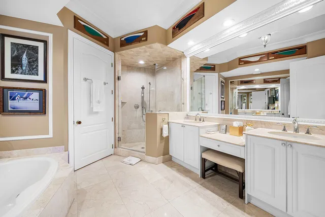 a living room with furniture a chandelier and a dining table