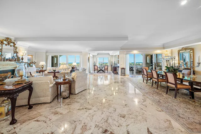 a view of a dining room with furniture and a window