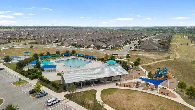 an aerial view of a house with outdoor space