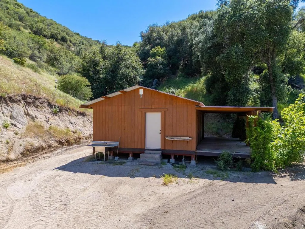 63 San Felipe Road Warner Springs, CA 92086 - Photo 24 of 43 a backyard of a house with yard and trampoline