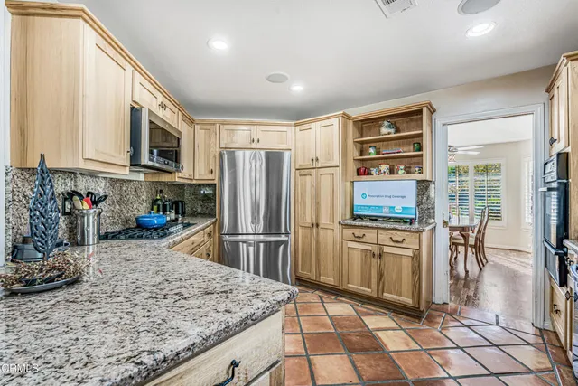 a bedroom with double bed and a chandelier