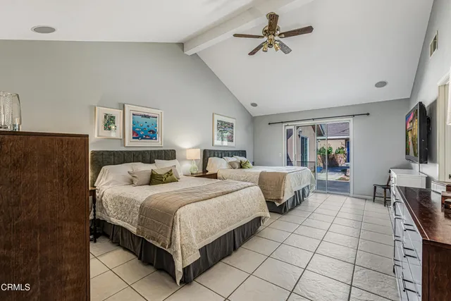 a bedroom with a bed and a table in it