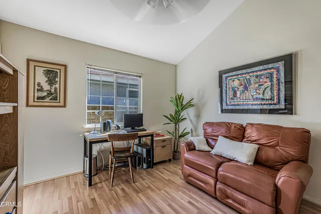 a view of a backyard with plants and a garden