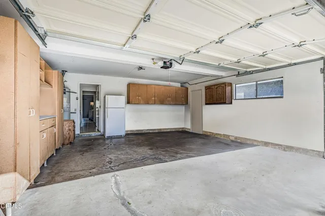 a view of a house with backyard tub and couches