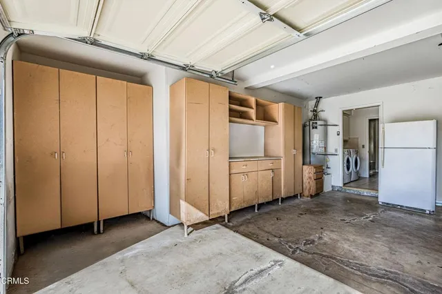 a view of a livingroom with furniture and a window