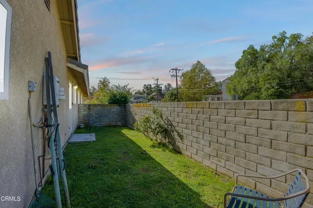 a spacious bedroom with a bed and a large window
