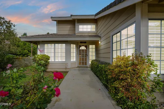 a front view of a house with yard